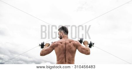 Man Sportsman Weightlifting. Steroids. Athletic Body. Dumbbell Gym. Fitness And Sport Equipment. Mus