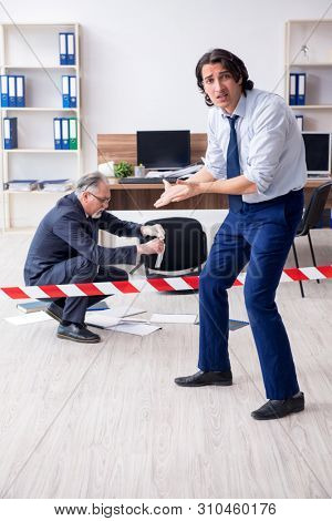 Forensic investigator investigating theft in the office