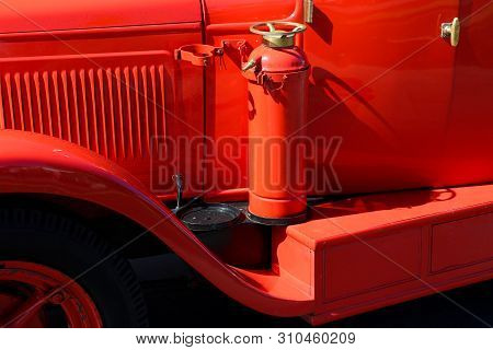 Detail Of Old Vintage Firetruck With Fire Extinguisher