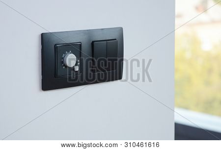 Black Light Switch On The Modern House Wall. Socket, Air Coditioning Button,  European Power.