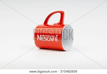 Kuala Lumpur, Malaysia - July 03, 2019:  Promotional Red Nescafe Mug On White Background. Selective 