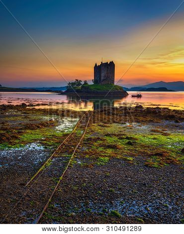 Sunset Over Castle Stalker On Loch Appin Located In Scotland, United Kingdom. Long Exposure.