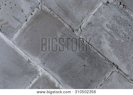 The Wall Of The Old Town Walls Of Concrete, Gray, Porous Blocks (diagonal Fragment)