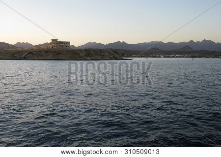 Red Sea Coast In Sharm El Sheikh, Egypt, Sinai, View Of The Pier, Where The Excursion Boats And The 