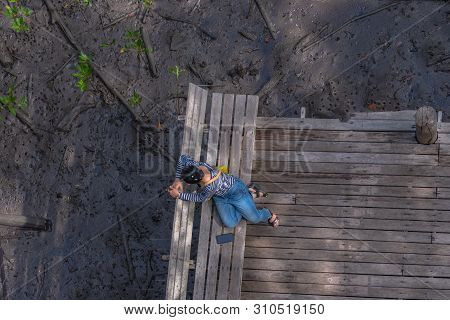 Lady Sitting On Balcony In Mangrove Forest Viewpoint