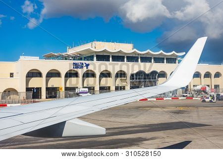 Wing View Airplane To The Main Building Of Malta International Airport Maltese Islands.. Luqa, Malta