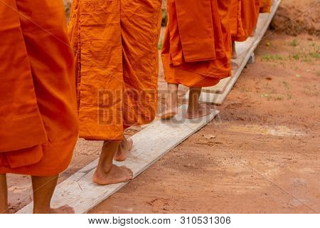 There Was A Merit Making In The Morning. People Would Scoop Food Into The Alms Of Many Monks.