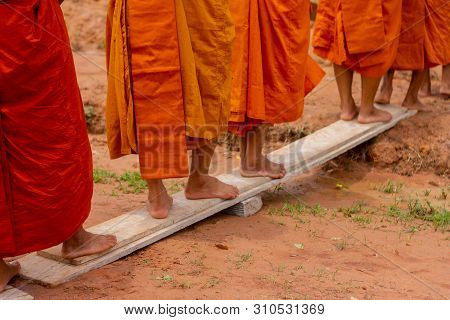 There Was A Merit Making In The Morning. People Would Scoop Food Into The Alms Of Many Monks.