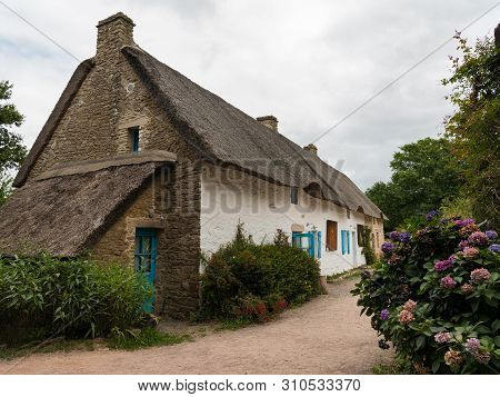 Old House In Saint Lyphard (france) With A Thatched Roof