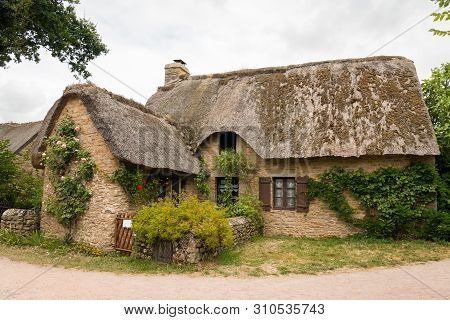 Old House In Saint Lyphard (france) With A Thatched Roof