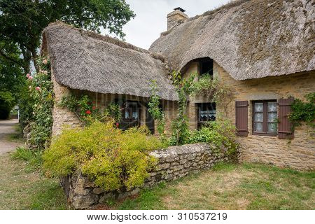 Old House In Saint Lyphard (france) With A Thatched Roof