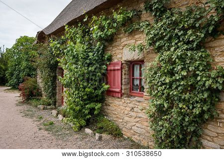 Old House In Saint Lyphard (france) With A Thatched Roof