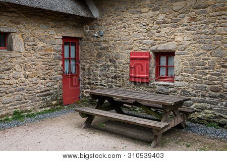 Old House In Saint Lyphard (france) With A Thatched Roof