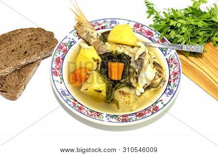 Ready Meals. Fish Soup In A Plate From Grouper (epinephelus Aeneus) On A White Background Close-up