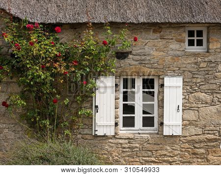 Old House In Saint Lyphard (france) With A Thatched Roof