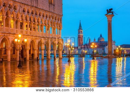 Piazza San Marco at night, view on venetian lion and san giorgio maggiore, Vinice, Italy