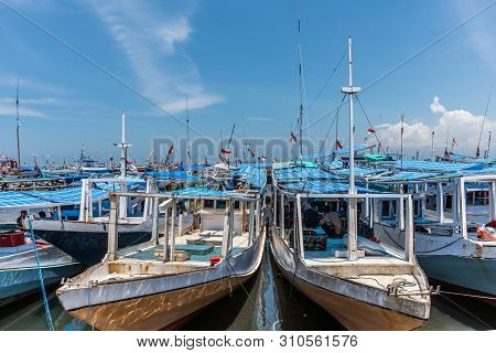 Makassar, Sulawesi, Indonesia - February 28, 2019: Paotere Old Port. Small Blue And White Fishing An