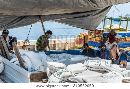 Makassar, Sulawesi, Indonesia - February 28, 2019: Paotere Old Port. Men Take A Break From Manually 