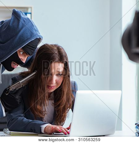 Criminal taking businesswoman as hostage in office