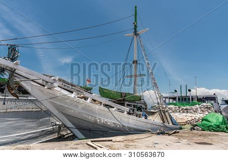 Makassar, Sulawesi, Indonesia - February 28, 2019: Paotere Old Port. White Amran Berkembang Island T