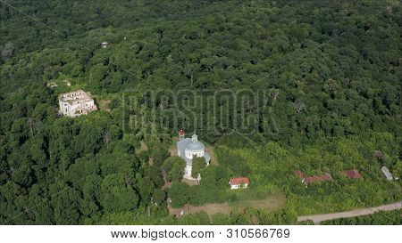 Fly Drone From The Old Church. Drone From A Birds Eye View Of An Old-abandoned Abandoned Church. Aba
