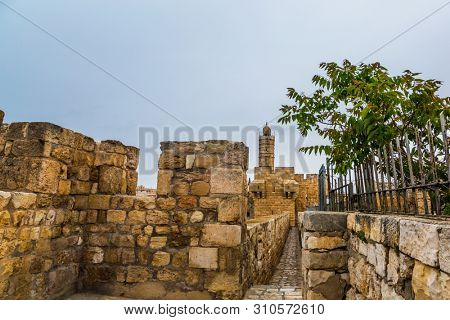 Narrow passage inside defensive wall. Eternal Jerusalem. Fascinating walk through the ancient walls of Jerusalem. The concept of historical and ethnographic torism
