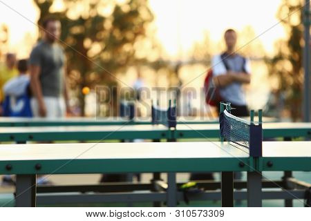 Green Ping Pong Table Outdoors. Table Tennis Equipment In Park.
