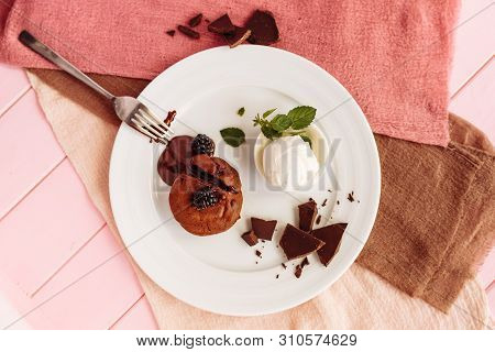 Dessert Fondan Chocolate With Ice-cream And Mint On A White Plate. Exquisite French Chocolate Desser