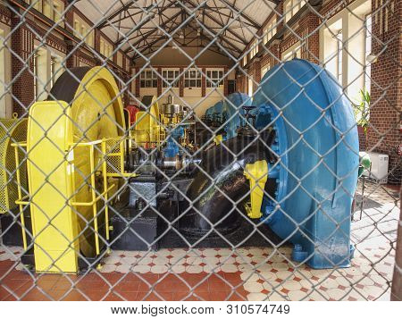 Old Water Engine Generator, Detail In Water Powerplant  Lesana, Poland. Industry Concept
