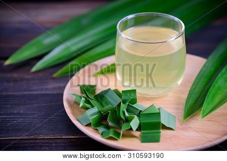 Pandan Drink And Sliced Pandan Leaf On Wooden Plate, Healthy Drink In Asian