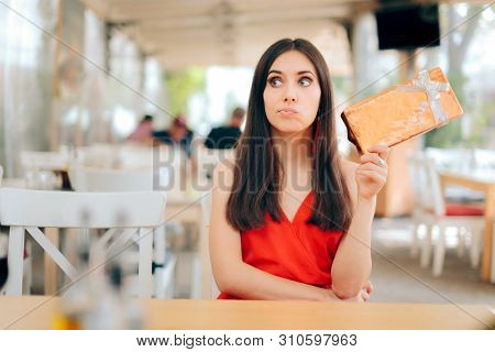 Curious Woman Checking Gift Box On A Date