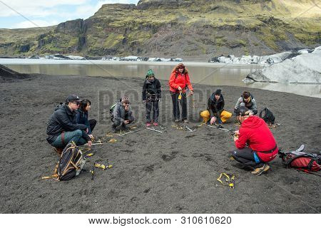 Tourists Hiking At Solheimajokull Glacier, Iceland