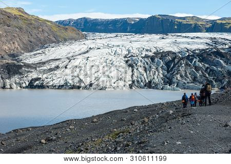 Tourists Hiking At Solheimajokull Glacier, Iceland