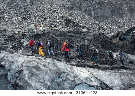Tourists Hiking At Solheimajokull Glacier, Iceland