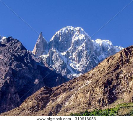 Ladyfinger Peak 6,000 M Above Sea Level, Is A Distinctive Rock Spire In The Batura Muztagh, The West