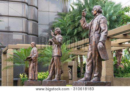 Singapore, Singapore - August 23, 2013: Dali, Dante And Chopin Sculptures At Parkview Square In Sing