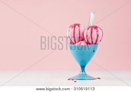 Three Pink Ice Cream Balls In Elegant Blue Plastic Bowl With Strawberry Sauce, Silver Spoon On White