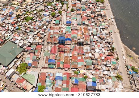 Streets Of Poor Areas In Manila. The Roofs Of Houses And The Life Of People In The Big City. Poor Di