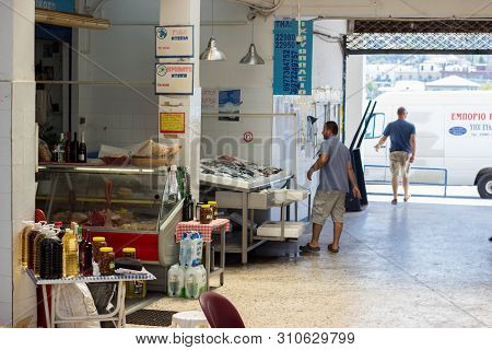 Neori, Poros Island, Greece. 25th Avg 2018: Greek Fishmonger Preparing And Packing Fish, Preparing H