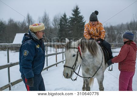 PODPOROZHYE, RUSSIA - JAN 21, 2018: Training of children riding in the framework of revival program of the Cossacks in the Leningrad region. Cossacks in St.Petersburg began its revival in 1990.