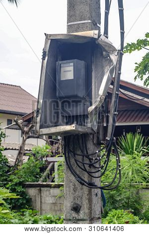 Broken Electric Meter Box On Pole . Denger Concept.