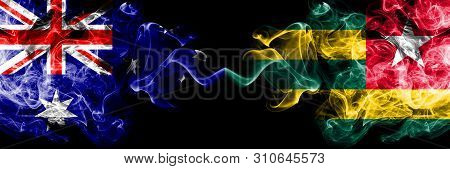 Australia Vs Togo, Togolese Smoky Mystic Flags Placed Side By Side. Thick Colored Silky Smokes Combi