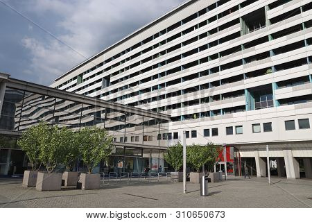Dresden, Germany - May 10, 2018: People Walk By Prager Zeile Condominium Building In Dresden, German