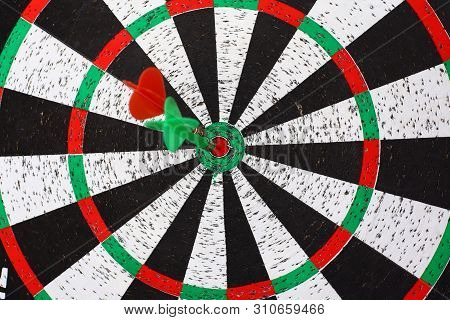 Closeup. Several Arrows Dart Hitting The Center Of The Target D
