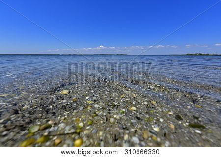Calm In The Sea Bay. Berdyansk Spit Is Located In The North Of The Azov Sea, Separating The Gulf Of 