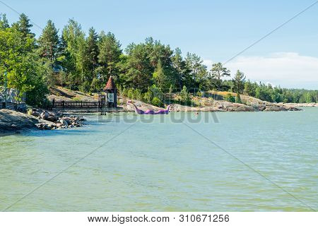 Naantali, Finland - 28 June, 2019: Bathing Hut And Edvard The Booble In Park Moominworld At Sunny Su