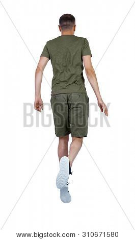 Back view of man in zero gravity or a fall. guy is flying, falling or floating in the air.  back view of person.  Isolated over white background. The guy is jumping or weight