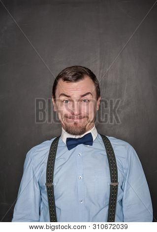 Handsome Business Man With Cry Expression On Blackboard