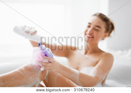 Hygiene Concept. Woman Washing With Sponge, Relaxig In Bath At Home