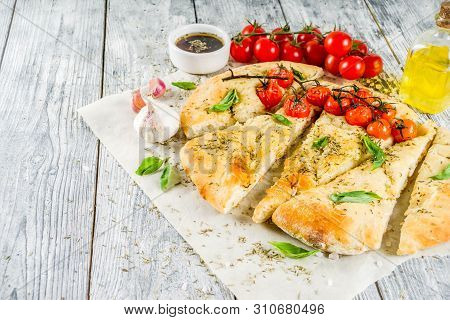 Traditional  Homemade Italian Flat Bread Focaccia. Focaccia With Tomatoes And Basil Leaves, Wooden B